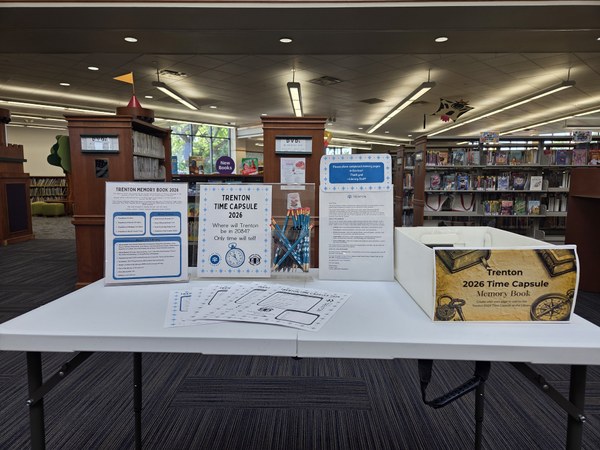 Table with Time Capsule Memory Pages to fill out at the library and submit for inclusion in the time capsule!